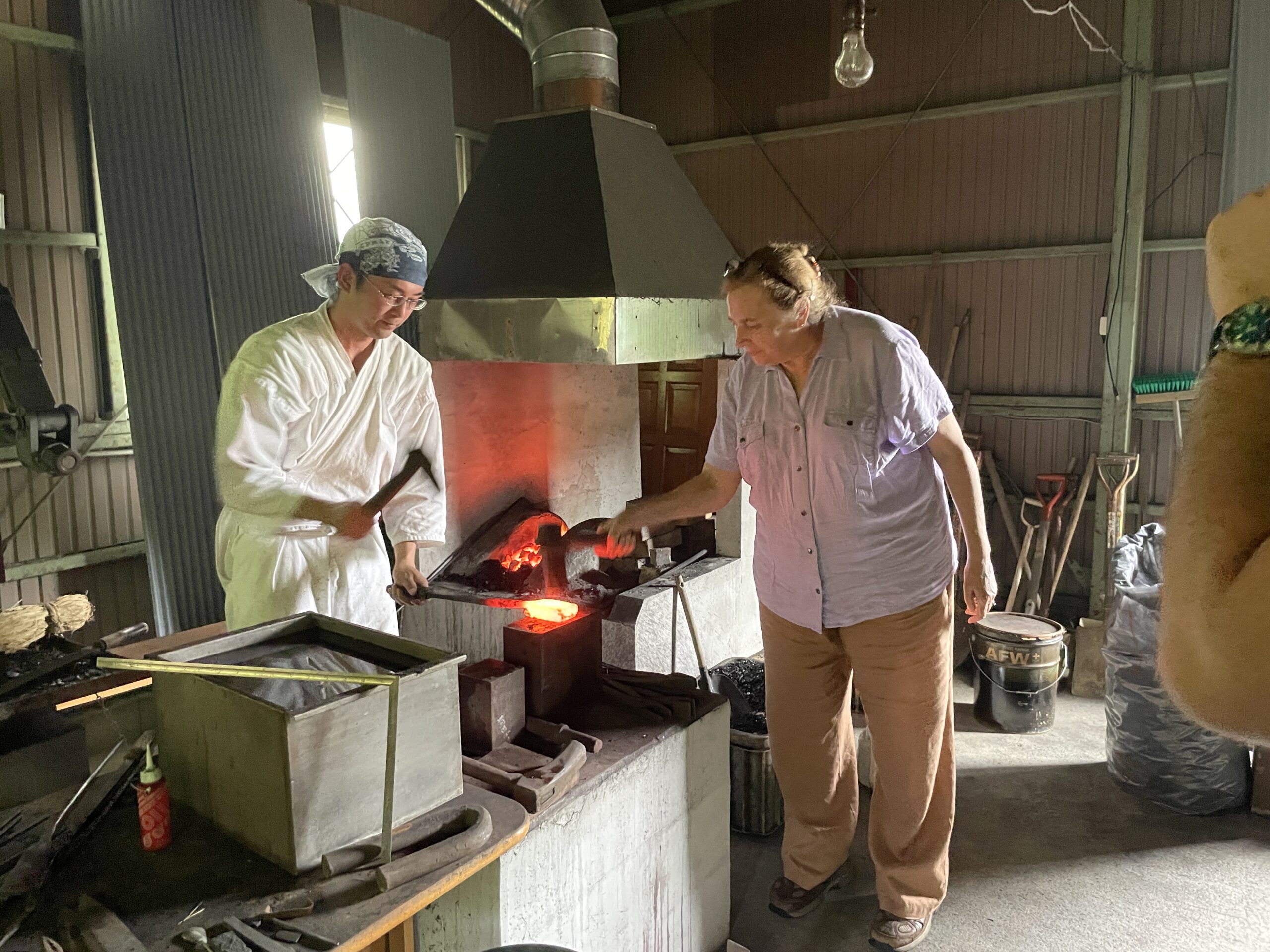 Tourist trying sword forging